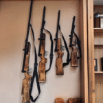 Handcrafted wooden rifle wall hanging with wrought iron detailing for home decor